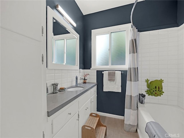15017 Archwood St, Van Nuys, CA 91405 - full bath featuring vanity, tasteful backsplash, and shower / bath combo with shower curtain