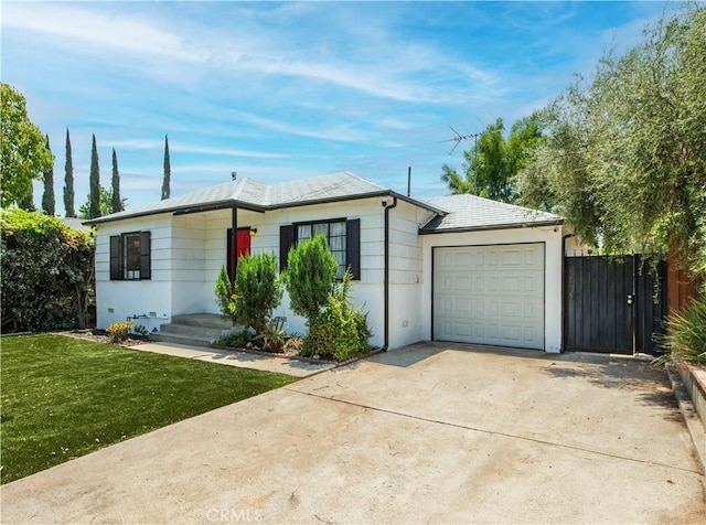17330 Califa St, Encino, CA 91316 - view of front of house featuring an attached garage and driveway
