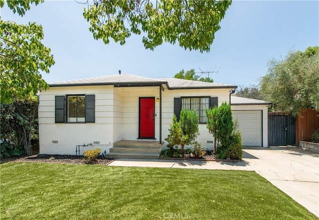 17330 Califa St, Encino, CA 91316 - view of front facade featuring driveway and a garage
