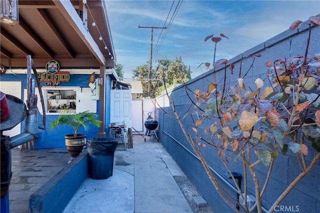 2561 E Washington St, Carson, CA 90810 - view of side of property with a fenced backyard and a patio area