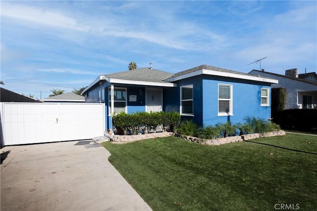 2561 E Washington St, Carson, CA 90810 - view of front facade featuring a front yard and a gate