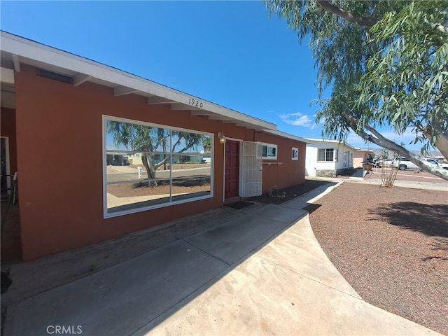 1920 Flora, Needles, CA 92363 - view of side of property featuring stucco siding