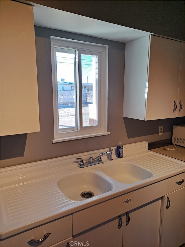 1920 Flora, Needles, CA 92363 - kitchen featuring white cabinetry and light countertops