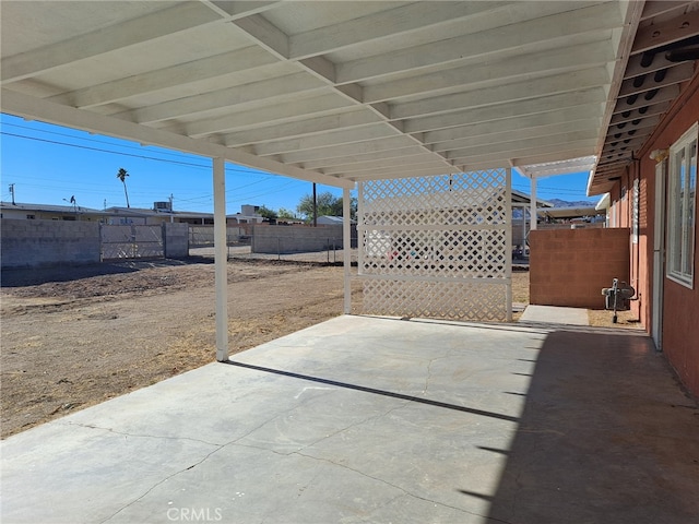 1920 Flora, Needles, CA 92363 - fenced backyard featuring a patio