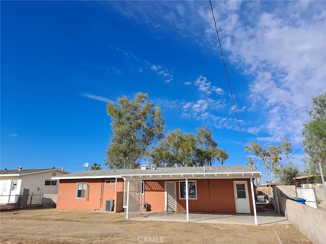 1920 Flora, Needles, CA 92363 - back of property featuring a patio and stucco siding