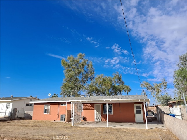 1920 Flora, Needles, CA 92363 - rear view of house with a patio and stucco siding