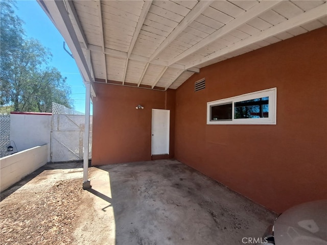 1920 Flora, Needles, CA 92363 - property entrance with stucco siding, a patio, and a gate