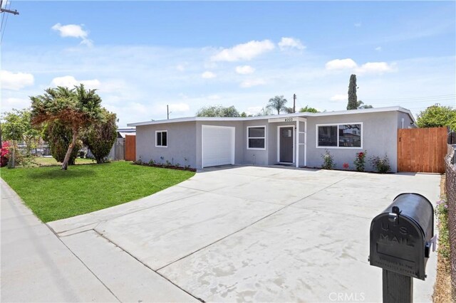 4003 Puente Ave, Baldwin Park, CA 91706 - ranch-style home with stucco siding, a garage, and concrete driveway