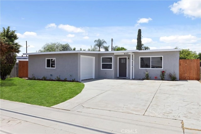 4003 Puente Ave, Baldwin Park, CA 91706 - ranch-style house with stucco siding, an attached garage, and concrete driveway
