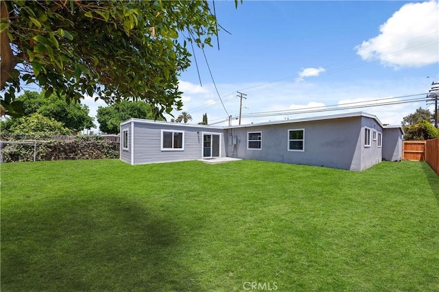 4003 Puente Ave, Baldwin Park, CA 91706 - rear view of house featuring stucco siding and a fenced backyard