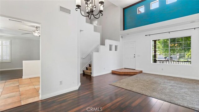 31850 Camino Marea, Temecula, CA 92592 - entryway featuring stairway, plenty of natural light, wood finished floors, a high ceiling, and a chandelier
