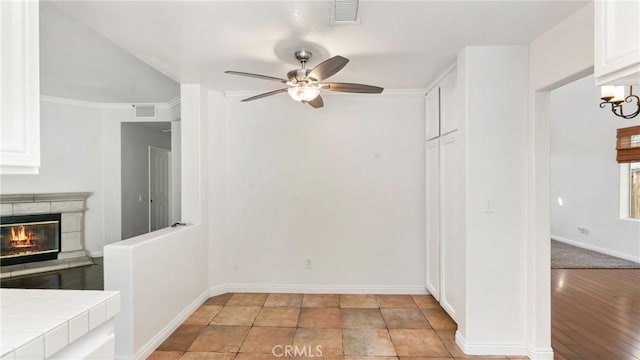 31850 Camino Marea, Temecula, CA 92592 - unfurnished dining area featuring a ceiling fan and a tiled fireplace