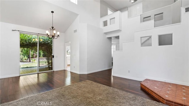 31850 Camino Marea, Temecula, CA 92592 - unfurnished room with hardwood / wood-style floors, a chandelier, and a towering ceiling