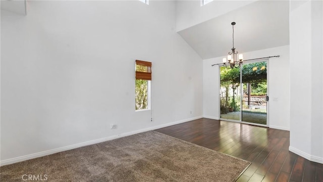 31850 Camino Marea, Temecula, CA 92592 - empty room featuring a towering ceiling, a chandelier, healthy amount of natural light, and wood finished floors