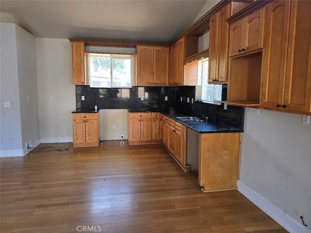 2723 Apache Trl, Clearlake Oaks, CA 95423 - kitchen featuring tasteful backsplash, dark wood finished floors, dark countertops, and brown cabinets