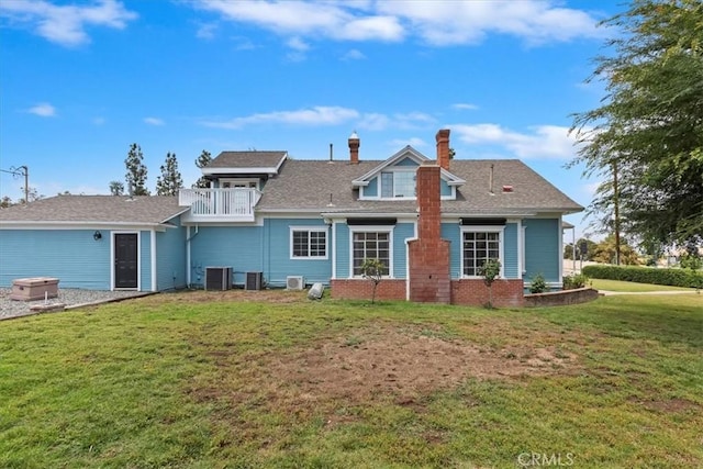 1350 E Chase Dr, Corona, CA 92881 - rear view of property featuring a balcony, a chimney, and a lawn