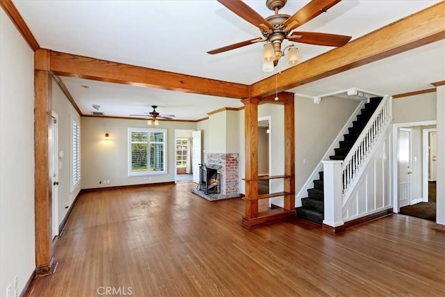 1350 E Chase Dr, Corona, CA 92881 - unfurnished living room with a ceiling fan, stairs, wood finished floors, beam ceiling, and crown molding