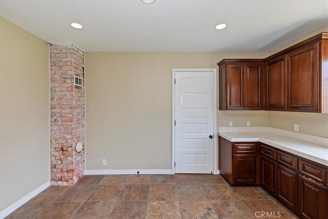 1350 E Chase Dr, Corona, CA 92881 - kitchen with recessed lighting, tile counters, and stone finish floors