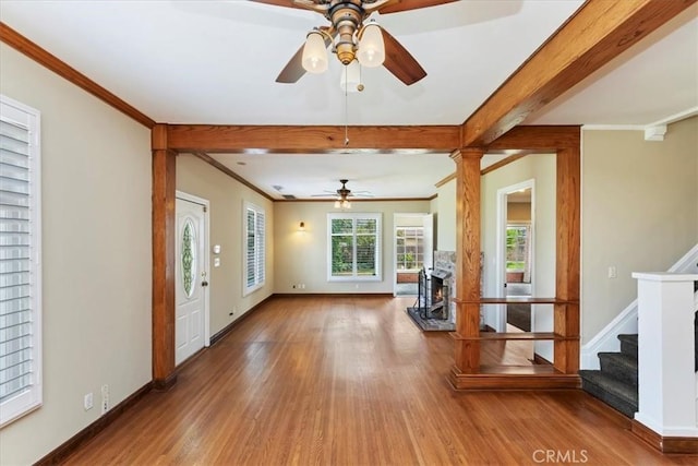 1350 E Chase Dr, Corona, CA 92881 - living area with wood finished floors, a ceiling fan, crown molding, stairs, and beamed ceiling