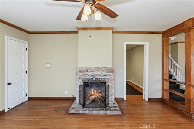 1350 E Chase Dr, Corona, CA 92881 - unfurnished living room featuring wood finished floors, crown molding, ceiling fan, a fireplace, and stairs