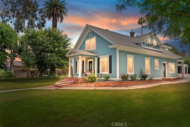 1350 E Chase Dr, Corona, CA 92881 - back of property with covered porch, a lawn, and a chimney