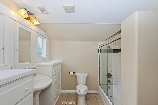 1350 E Chase Dr, Corona, CA 92881 - bathroom with tile patterned flooring, shower / bath combination with glass door, vaulted ceiling, and vanity