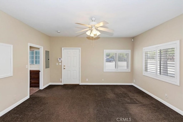 1350 E Chase Dr, Corona, CA 92881 - spare room with electric panel, dark colored carpet, and a ceiling fan