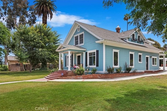 1350 E Chase Dr, Corona, CA 92881 - view of front of property featuring a front lawn, covered porch, and a shingled roof