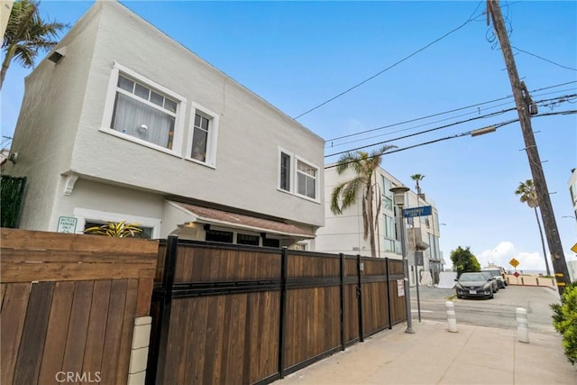 121/2 25th Pl Unit 1, Venice, CA 90291 - rear view of house with stucco siding and a gate