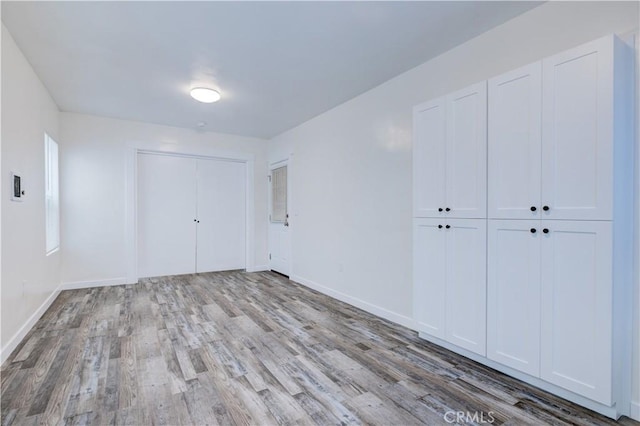 121/2 25th Pl Unit 1, Venice, CA 90291 - unfurnished bedroom featuring wood finished floors and baseboards