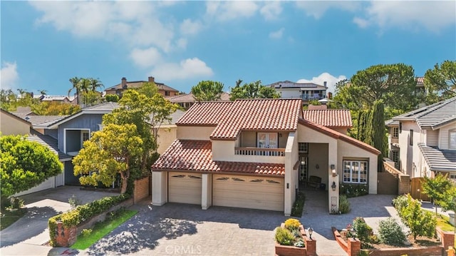 28161 Haria, Mission Viejo, CA 92692 - view of front facade with a balcony, stucco siding, a garage, a residential view, and driveway