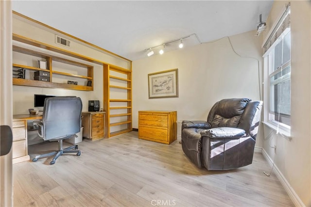28161 Haria, Mission Viejo, CA 92692 - home office with light wood-style flooring, built in study area, and rail lighting
