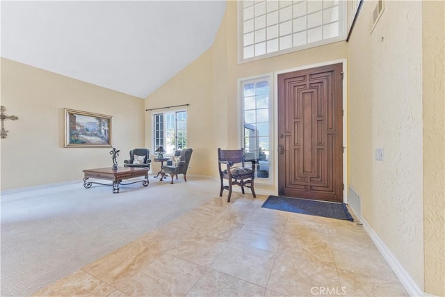 28161 Haria, Mission Viejo, CA 92692 - foyer with a towering ceiling, a textured wall, and carpet