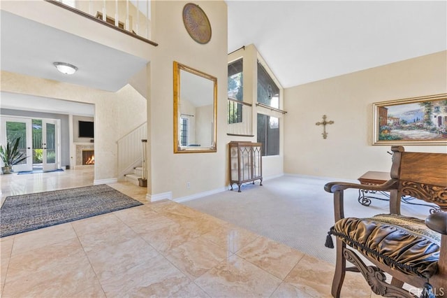 28161 Haria, Mission Viejo, CA 92692 - entryway with a towering ceiling, stairway, carpet flooring, and a lit fireplace
