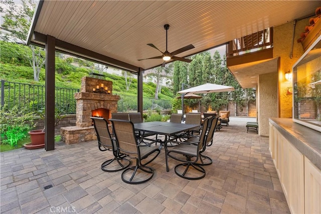 28161 Haria, Mission Viejo, CA 92692 - view of patio / terrace featuring an outdoor stone fireplace, ceiling fan, and outdoor dining space