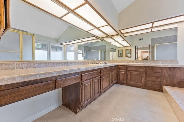 28161 Haria, Mission Viejo, CA 92692 - bathroom featuring lofted ceiling, a stall shower, tile patterned floors, and double vanity