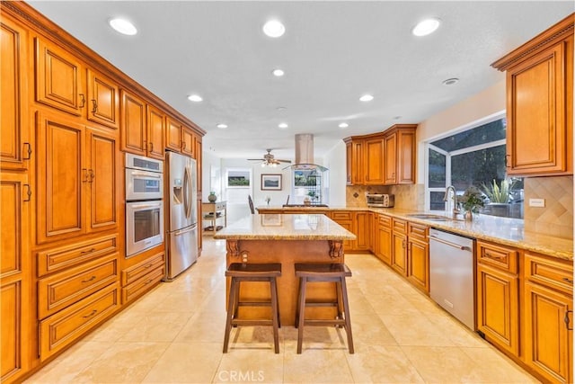 28161 Haria, Mission Viejo, CA 92692 - kitchen with appliances with stainless steel finishes, recessed lighting, decorative backsplash, a breakfast bar area, and brown cabinets