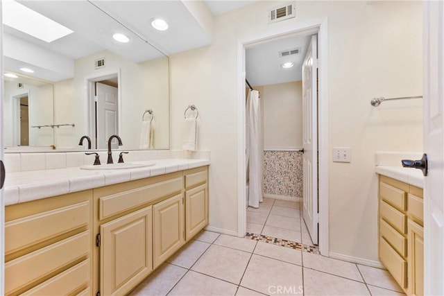 28161 Haria, Mission Viejo, CA 92692 - bathroom featuring a skylight, vanity, tile patterned floors, curtained shower, and recessed lighting