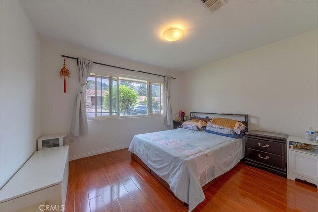 1454 Ameluxen Ave, Hacienda Heights, CA 91745 - bedroom with wood finished floors and baseboards