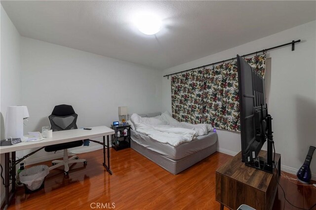 1454 Ameluxen Ave, Hacienda Heights, CA 91745 - bedroom featuring wood finished floors and an office area