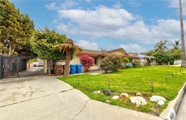 1454 Ameluxen Ave, Hacienda Heights, CA 91745 - view of front facade with a gate, driveway, stucco siding, and a tiled roof