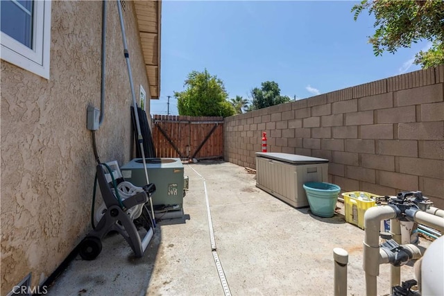 2091 Ridgeview, Corona, CA 92882 - fenced backyard featuring a gate and a patio