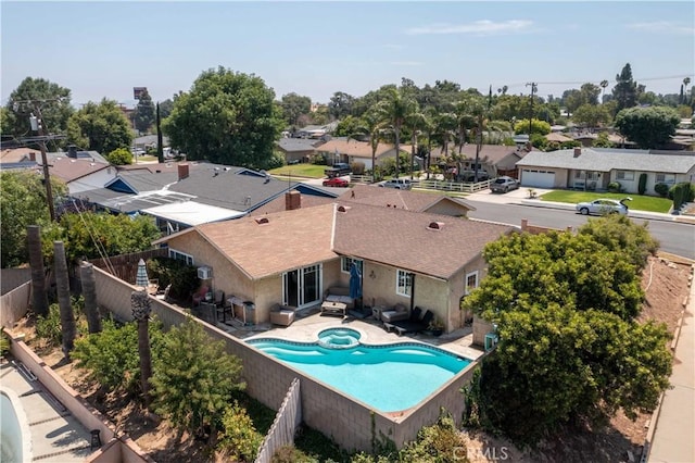 2091 Ridgeview, Corona, CA 92882 - view of pool featuring a fenced backyard, a residential view, and a pool with connected hot tub