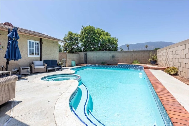 2091 Ridgeview, Corona, CA 92882 - view of pool featuring a pool with connected hot tub, a mountain view, a fenced backyard, and a patio area