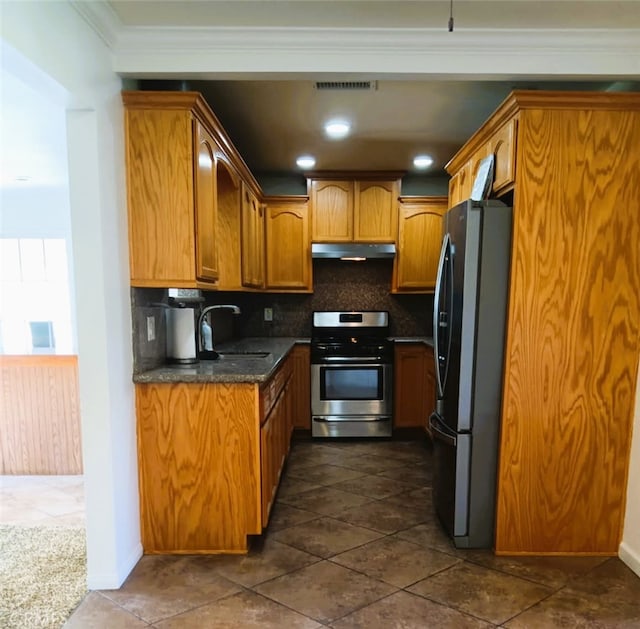 16614 Samgerry Dr, Valinda, CA 91744 - kitchen with appliances with stainless steel finishes, tasteful backsplash, under cabinet range hood, brown cabinets, and ornamental molding