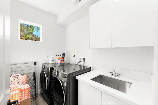 1359 Point Loma Pl, Walnut, CA 91789 - laundry room with washer and dryer, cabinet space, and light wood-style floors