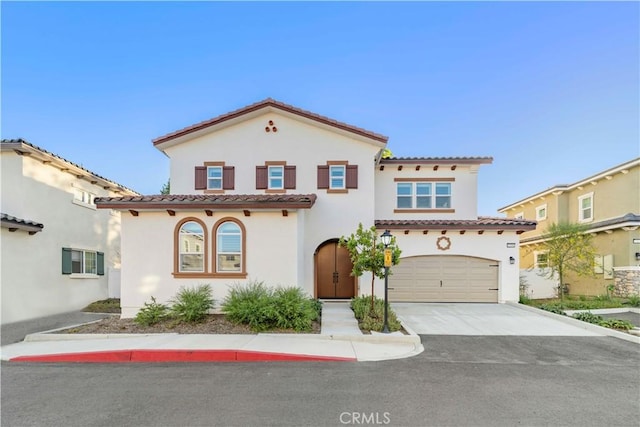 1359 Point Loma Pl, Walnut, CA 91789 - mediterranean / spanish-style home with a tiled roof, stucco siding, driveway, and an attached garage