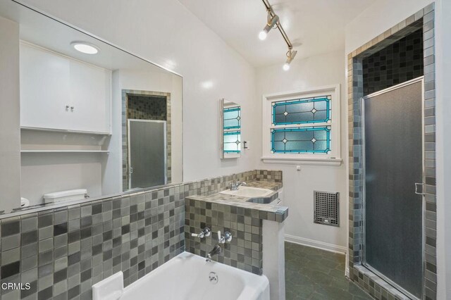 664 Monterey Rd, South Pasadena, CA 91030 - full bathroom featuring a stall shower, a tub, and rail lighting