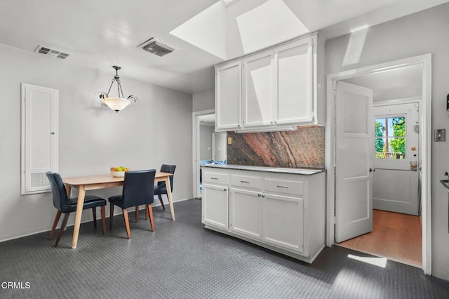 664 Monterey Rd, South Pasadena, CA 91030 - kitchen featuring white cabinets, pendant lighting, and decorative backsplash