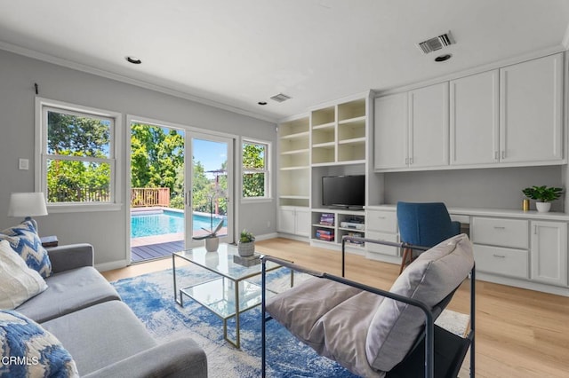 664 Monterey Rd, South Pasadena, CA 91030 - living room featuring built in desk, ornamental molding, and light wood finished floors
